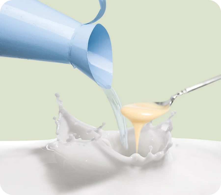 Water poured over Almondie almond butter to make almond milk